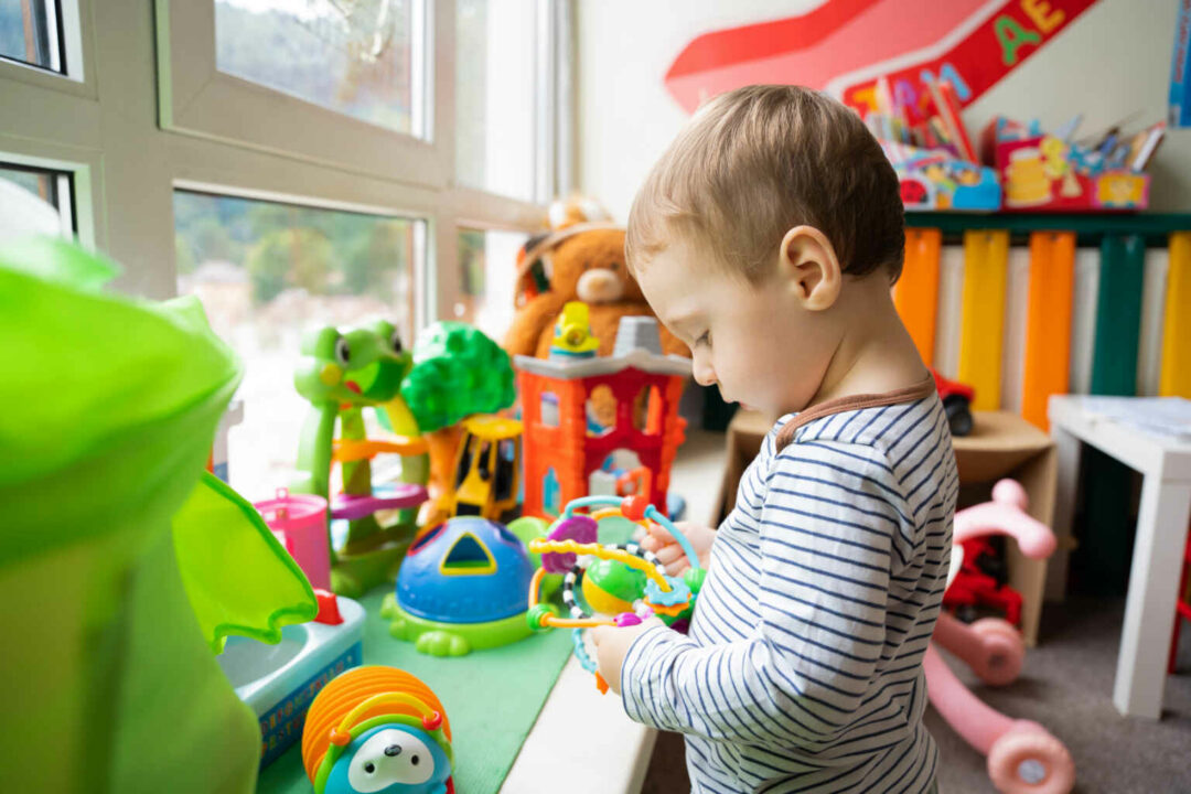 toddler boy plays with educational toys in the chi 2023 05 04 02 43 38 utc